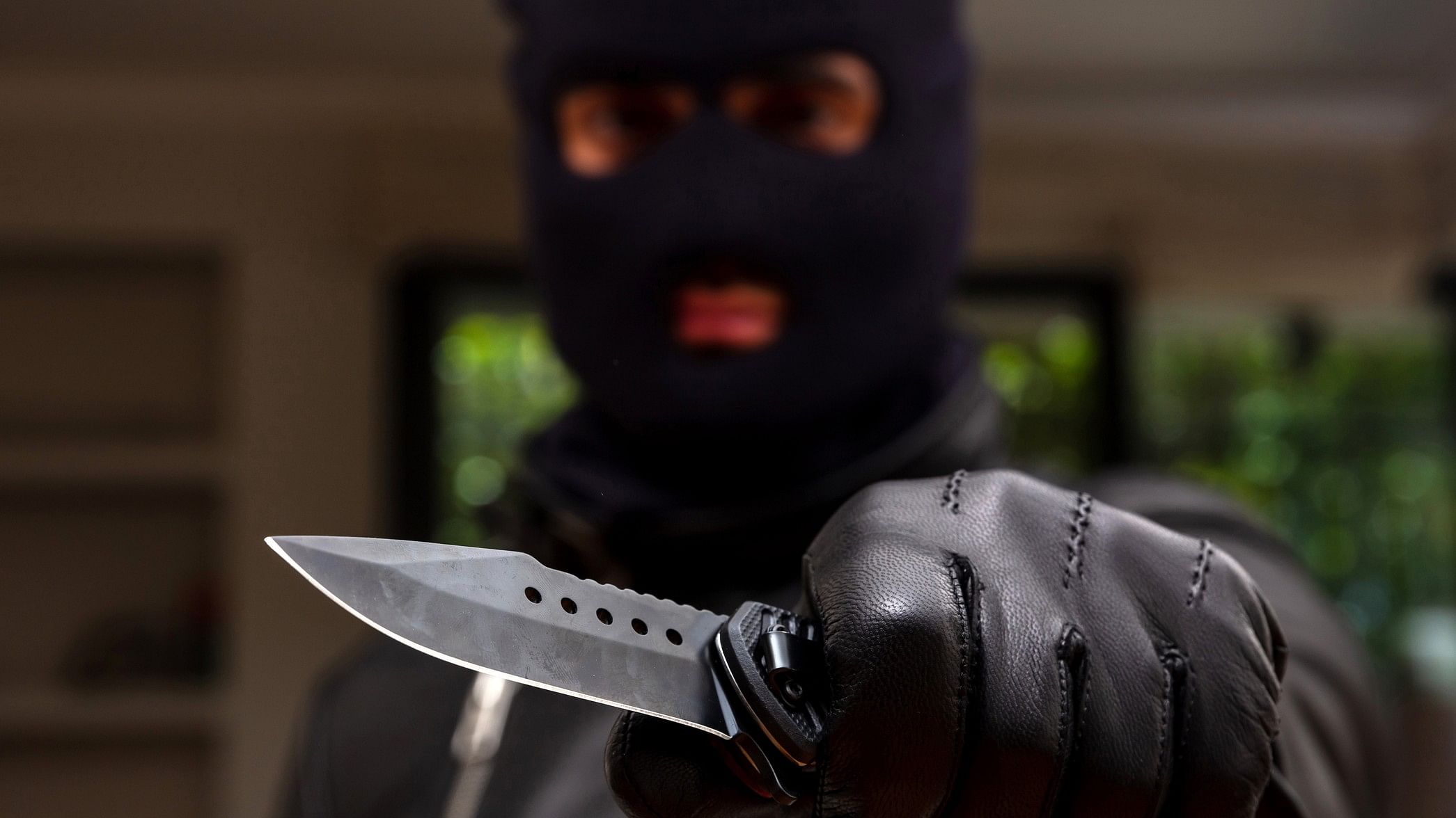 <div class="paragraphs"><p>Representative image showing a man in a ski mask carrying a knife</p></div>