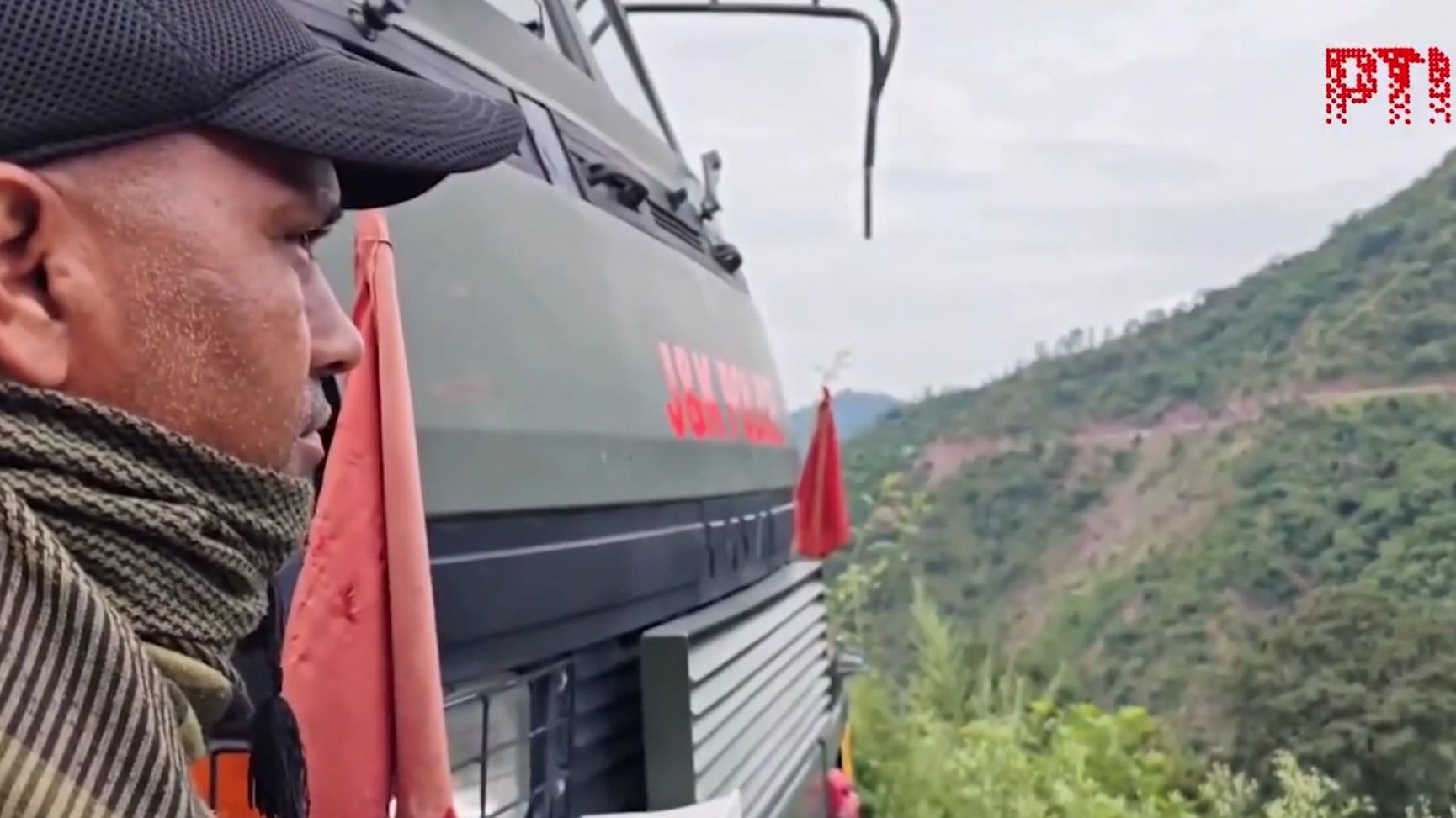 <div class="paragraphs"><p>A security official looks on during the ongoing encounter with terrorists in J&amp;K's Rajouri. Screengrab taken from the operation video</p></div>