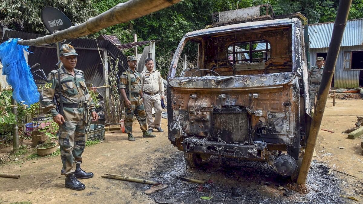 <div class="paragraphs"><p>Security personnel inspect a locality where houses were demolished and burnt following an alleged vandalisation of a Kali idol, in Ranirbazar area of west Tripura.</p></div>