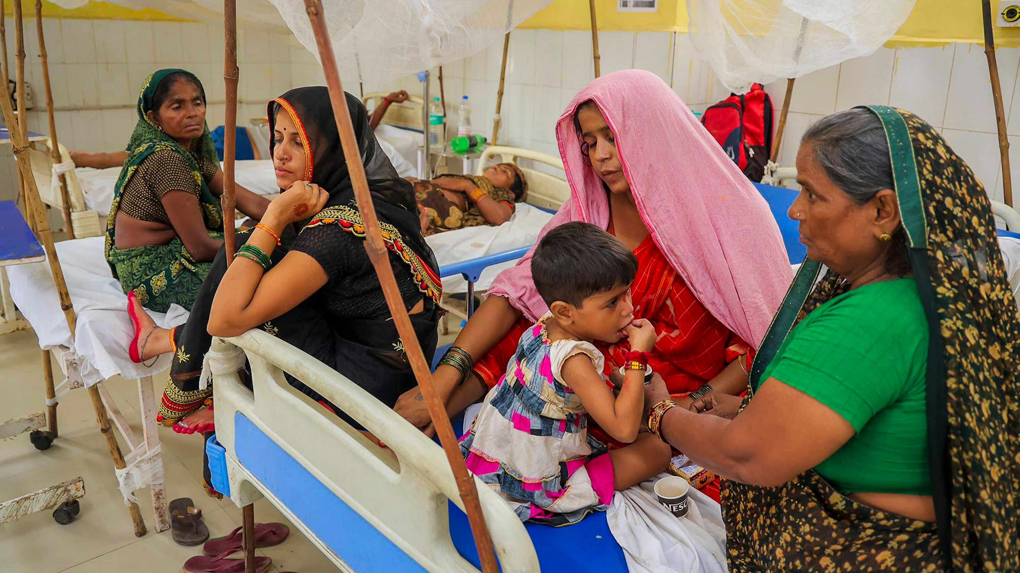 <div class="paragraphs"><p>People being treated at a district hospital as their health deteriorated following the consumption of suspected food poisoning, in Mathura, Tuesday, Aug. 27, 2024. </p></div>