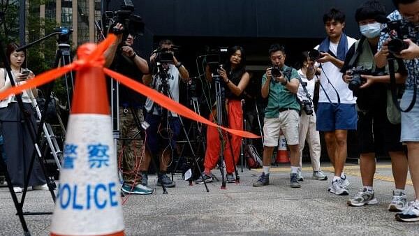 <div class="paragraphs"><p>Members of the media work outside District Court ahead of the verdict in a landmark sedition trial against two former editors of now-shuttered online media Stand News, in Hong Kong, China, August 29, 2024. </p></div>