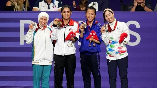 <div class="paragraphs"><p>Gold medallist Leonor Angelica Espinoza Carranza of Peru celebrates on the podium during the medal ceremony alongside Silver medallist Ziyodakhon Isakova of Uzbekistan and Bronze medallists Khwansuda Phuangkitcha of Thailand and Zakia Khudadadi of Refugee Paralympic Team. </p></div>