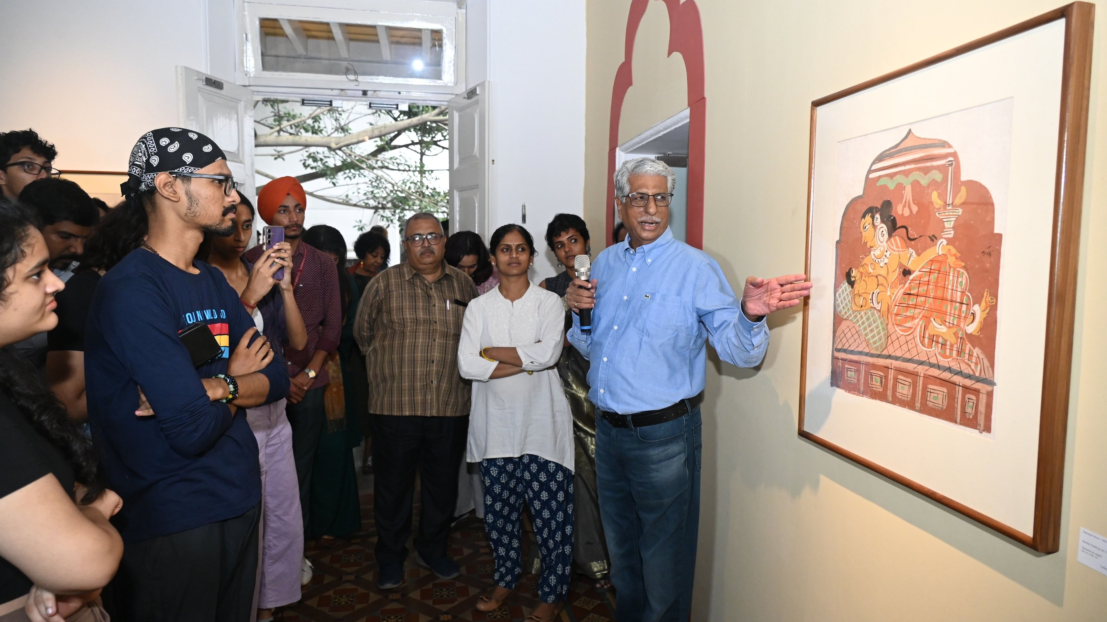 <div class="paragraphs"><p>Art historian Deepak Kannal explains a piece by modern Indian artist Nandalal Bose at the National Gallery of Modern Art in Bengaluru on Friday. </p></div>