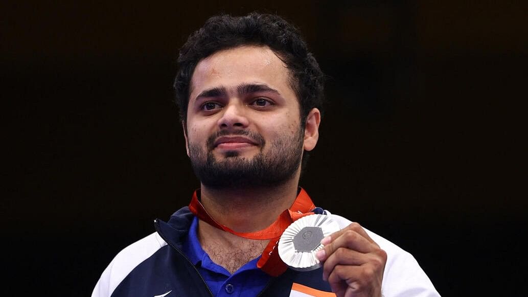 <div class="paragraphs"><p>Manish Narwal of India poses with his silver medal during the medal ceremony.</p></div>