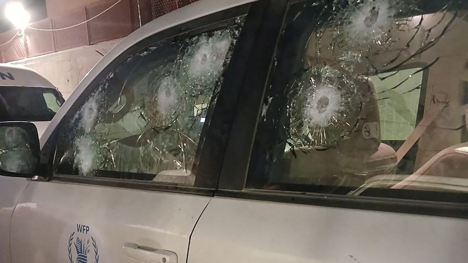 <div class="paragraphs"><p>Impacts on a World Food Program's  bullet-proof windows are seen after the WFP said the vehicle came under fire a few metres from an Israeli check point at the Wadi Gaza bridge in Al-Mughraqa, Gaza Strip.</p></div>