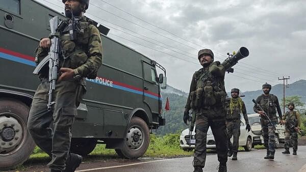 <div class="paragraphs"><p>Army personnel move towards the encounter site, in Lathi village in Jammu and Kashmir's Rajouri district.</p></div>