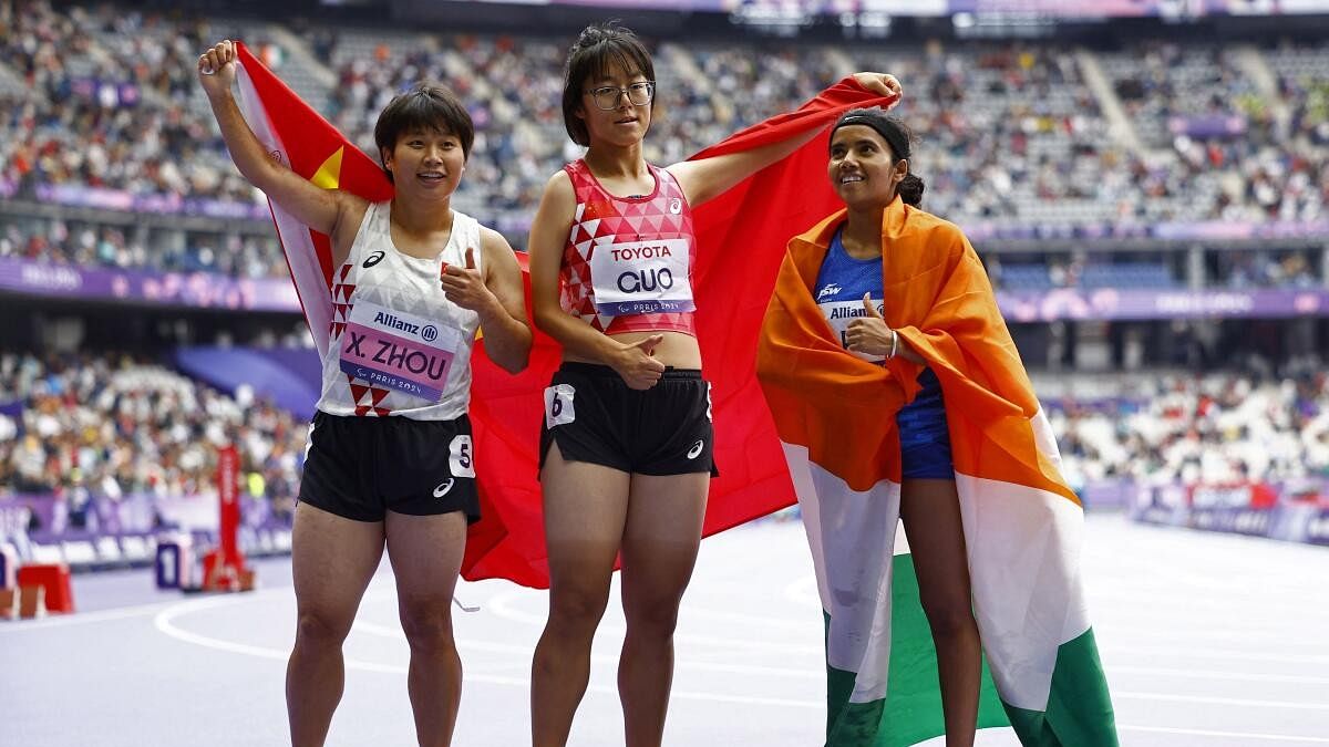 <div class="paragraphs"><p>Gold medallist Xia Zhou of China celebrates with silver medallist Qianqian Guo of China and bronze medallist Preethi Pal of India.</p></div>