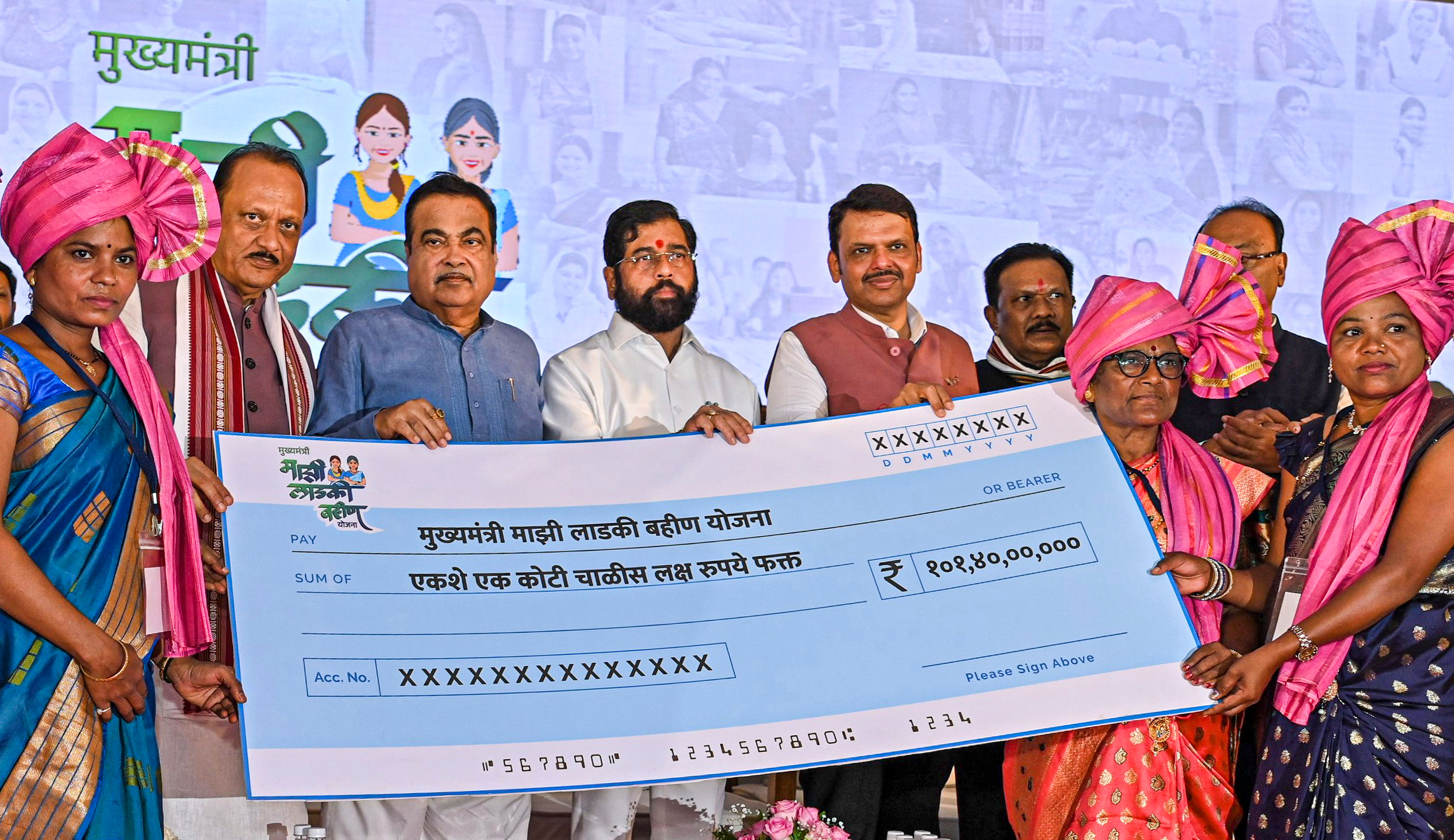 <div class="paragraphs"><p>File photo of Nitin Gadkari, Maharashtra CM Eknath Shinde and his deputies Devendra Fadnavis and Ajit Pawar presenting a cheque to a beneficiary during the inauguration of phase-two of the Mukhyamantri Majhi Ladki Bahin scheme, in Nagpur.</p></div>