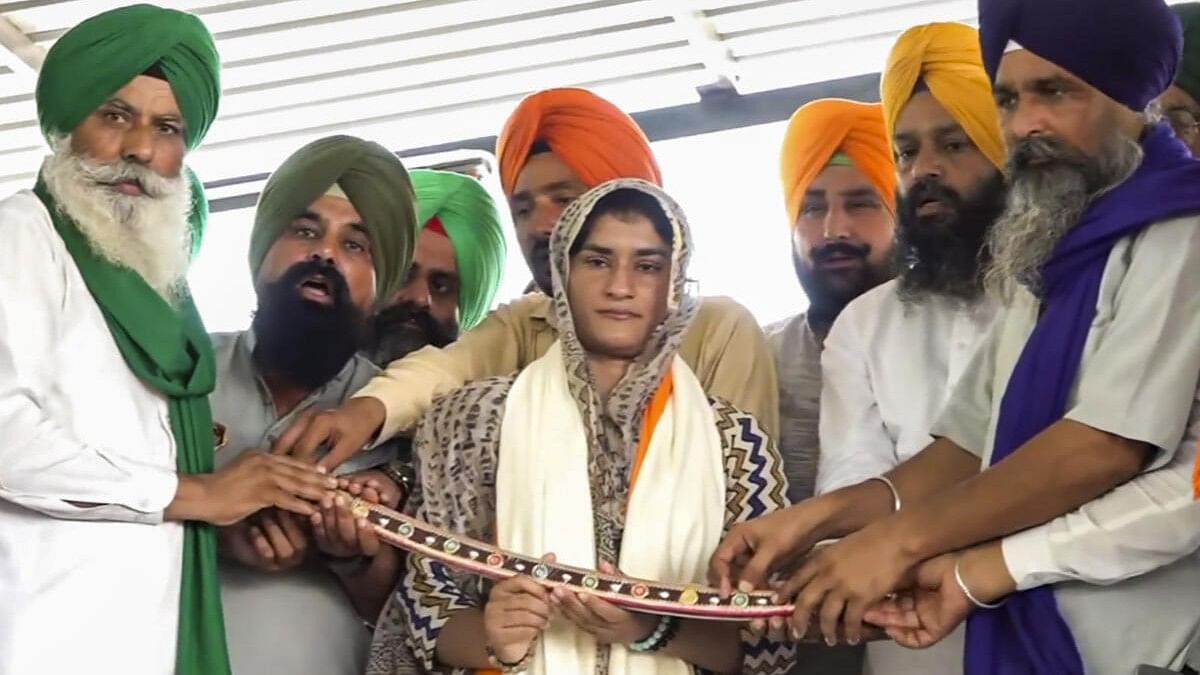 <div class="paragraphs"><p>Olympian Vinesh Phogat being felicitated at a farmers' rally on the 200th day of their ongoing protest, at Shambhu border.</p></div>