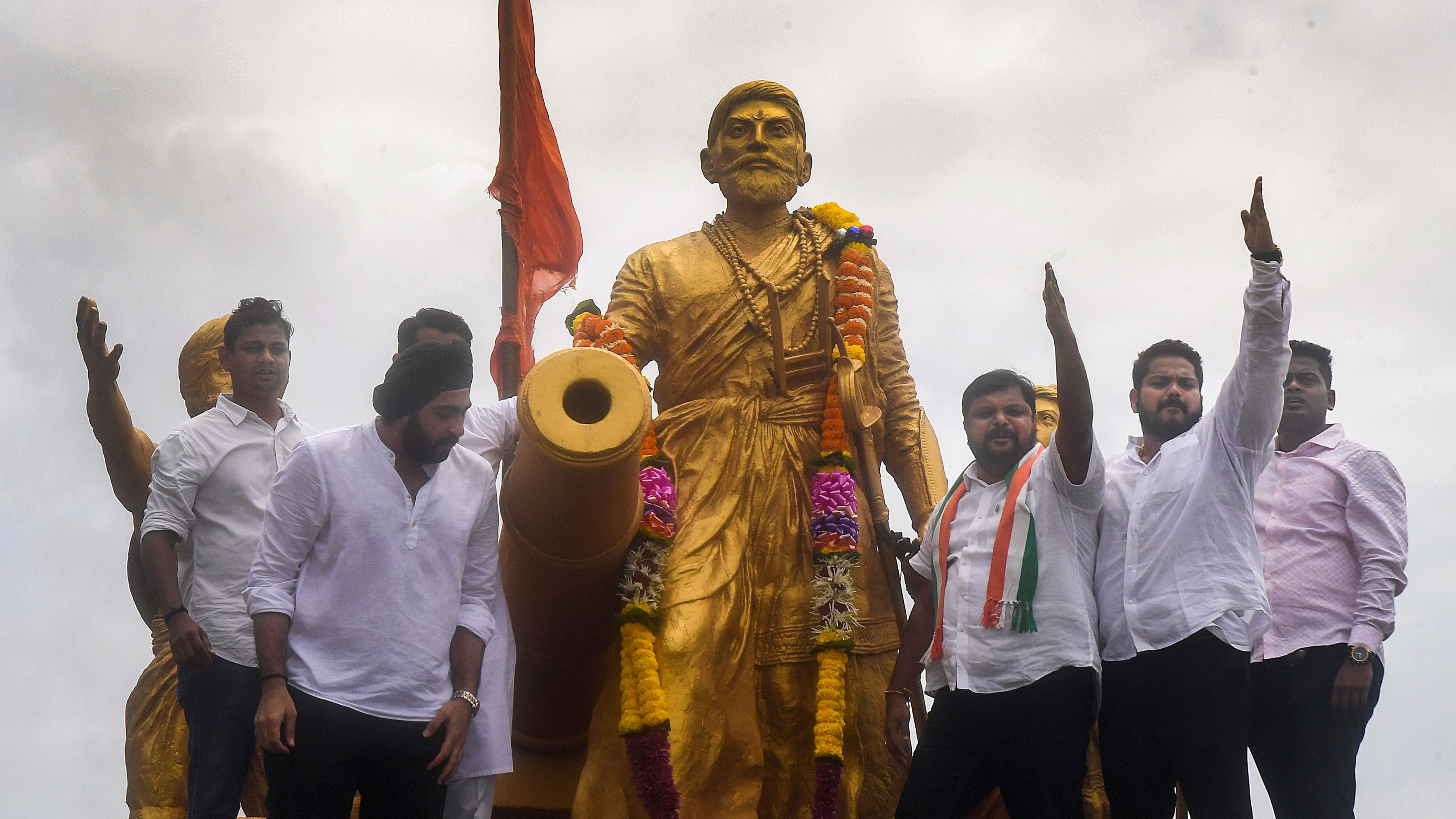 <div class="paragraphs"><p> Members of Maharashtra Youth Congress stage a protest near Chhatrapati Shivaji Maharaj's statue against the state government over recent collapse of Malvan's Shivaji Maharaj statue, in Mumbai, Saturday, Aug 31, 2024.</p></div>