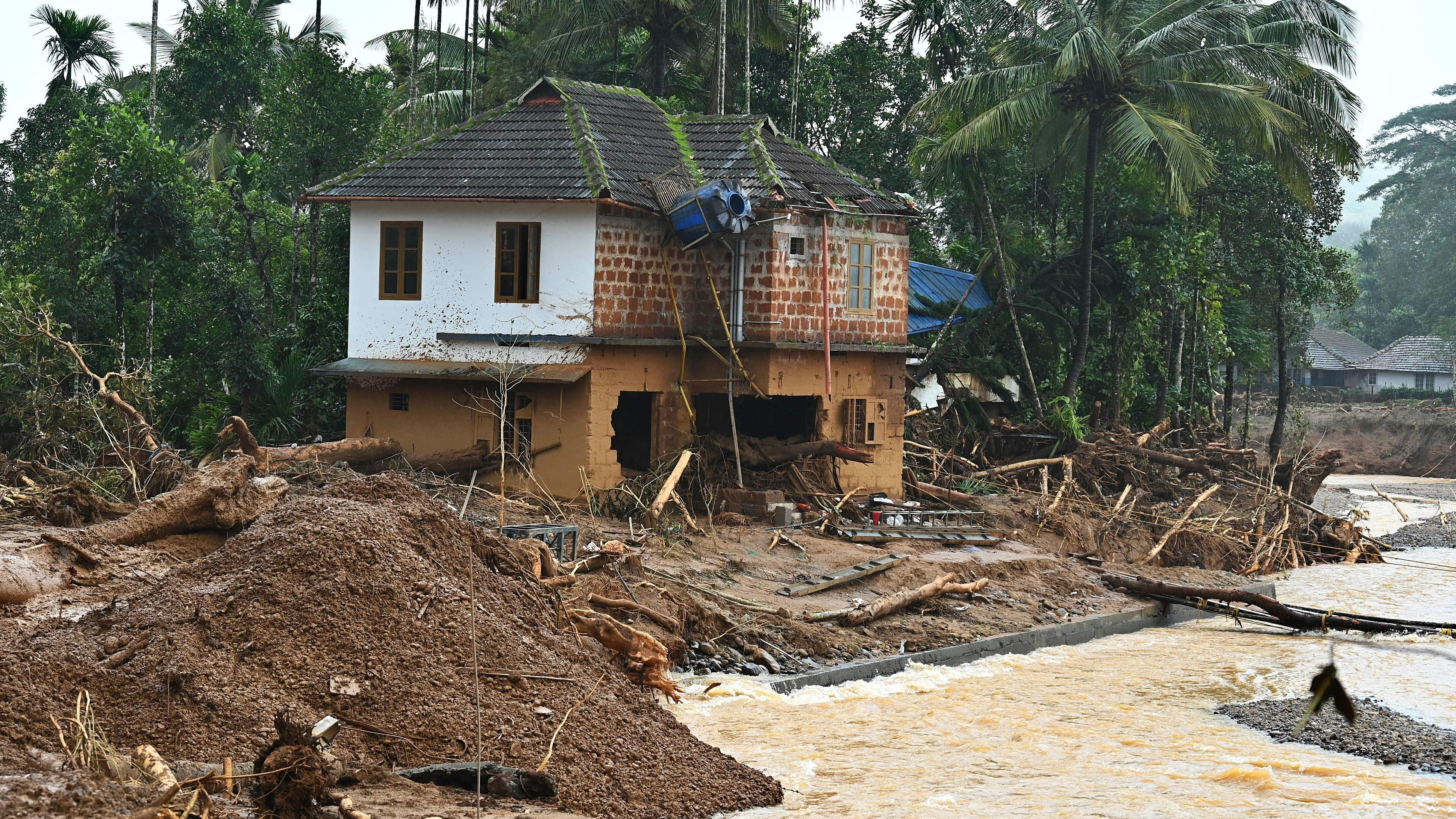 <div class="paragraphs"><p>A house ravaged by landslide at Chooralmala area in Wayanad, Kerala, on Thursday. </p></div>