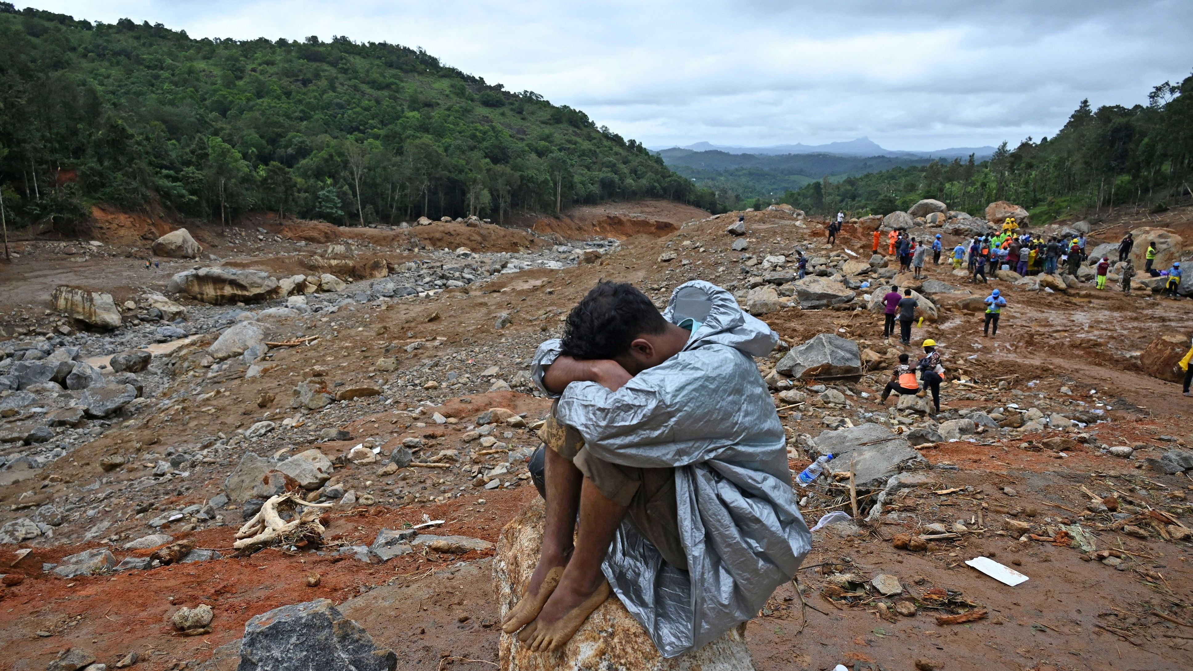 <div class="paragraphs"><p>A resident of&nbsp;Mundakkai in Wayanad sits on a boulder near where he lost his family members.</p></div>