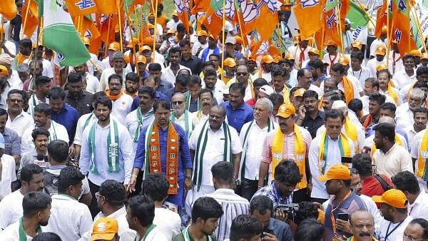 <div class="paragraphs"><p>Union Minister &amp; JD(S) leader H D Kumaraswamy, his son and party youth leader Nikhil Kumaraswamy with Karnataka BJP Chief B Y Vijayendra, R Ashoka and others take part in Bengaluru-Mysuru padyatra against the alleged MUDA scam and Valmiki Corporation scam, in Ramnagar near Bengaluru.</p></div>