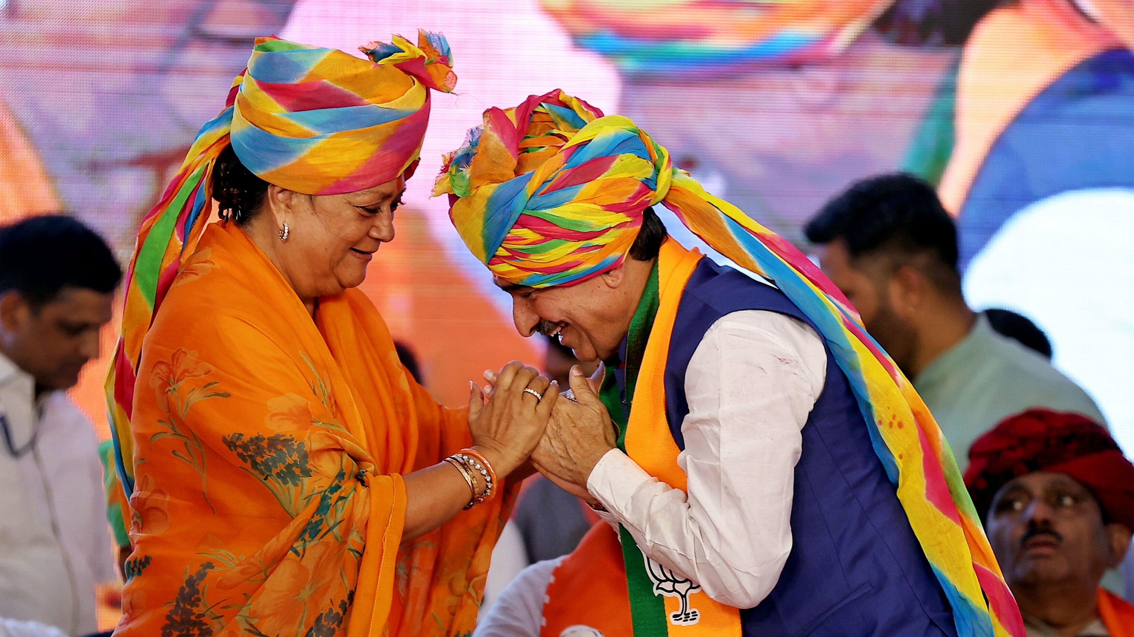 <div class="paragraphs"><p>Newly appointed Rajasthan BJP President Madan Rathore with party leader Vasundhara Raje during the former's taking-charge ceremony, in Jaipur, Saturday, Aug. 3, 2024.</p></div>