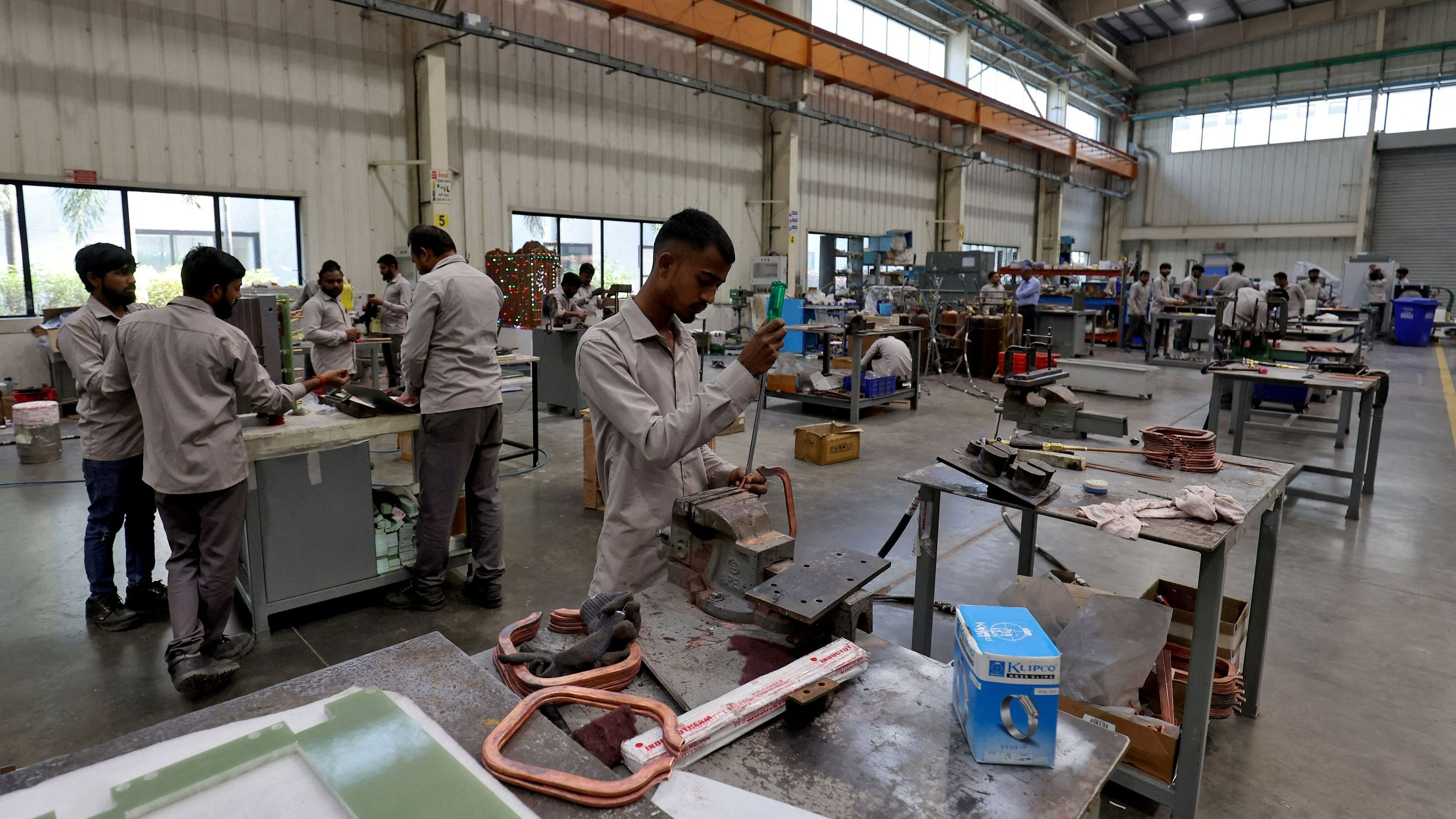 <div class="paragraphs"><p>FILE PHOTO: Employees assemble an electric transformer inside a manufacturing unit of Inductotherm (India) Private Limited at Sanand GIDC (Gujarat Industrial Development Corporation), on the outskirts of Ahmedabad, India, March 28, 2024. </p></div>