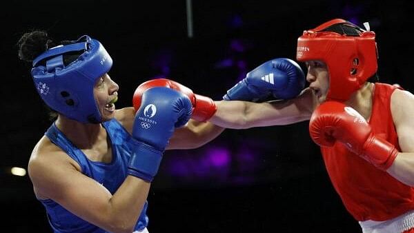 <div class="paragraphs"><p>Paris 2024 Olympics - Boxing - Women's 75kg - Quarterfinal - North Paris Arena, Villepinte, France - August 4, 2024. Lovlina Borgohain (L) in action against Qian Li of China.</p></div>