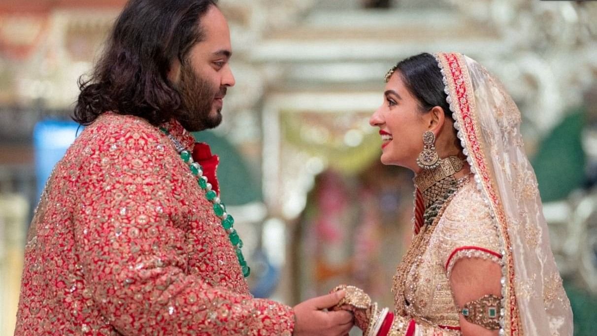 <div class="paragraphs"><p>Anant Ambani, son of Indian billionaire Mukesh Ambani, and Radhika Merchant, daughter of industrialist Viren Merchant, react during their wedding celebrations in Mumbai, India, July 12, 2024. </p></div>