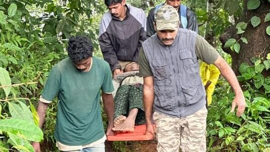 <div class="paragraphs"><p>Kalpetta Range forest officers rescue a family from a landslide-affected area of Wayanad district on August 4, 2024.</p></div>