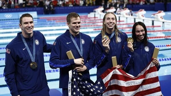 <div class="paragraphs"><p>Gold medallists Ryan Murphy, Nic Fink, Gretchen Walsh and Torri Huske of United States pose with their medals as they celebrate winning the final.</p></div>