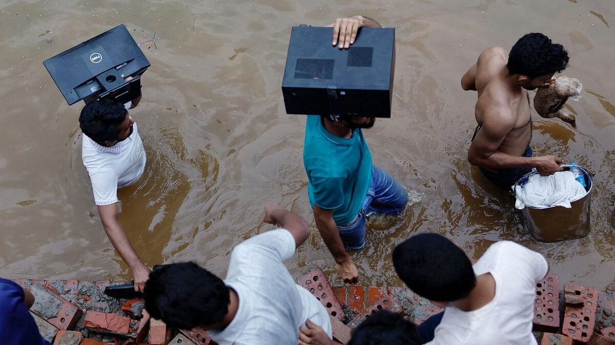 <div class="paragraphs"><p>People loot a monitor, a computer and a duck from the Ganabhaban, the prime minister's residence, after the resignation of PM Sheikh Hasina in Dhaka</p></div>