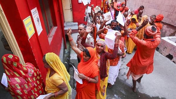 <div class="paragraphs"><p>Pilgrims wait for registration of Amarnath Yatra, at Mahajan Hall registeration counter, in Jammu.</p></div>