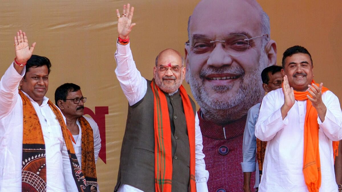 <div class="paragraphs"><p>Union Home Minister Amit Shah with BJP WB President Sukanta Majumdar and party leader Suvendu Adhikari.</p></div>