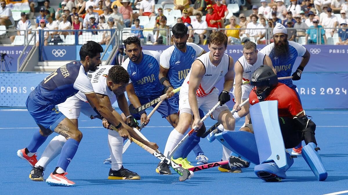 <div class="paragraphs"><p>India's goalkeeper Sreejesh PR tries to check Belgium's Nelson Onana Alima.&nbsp;</p></div>