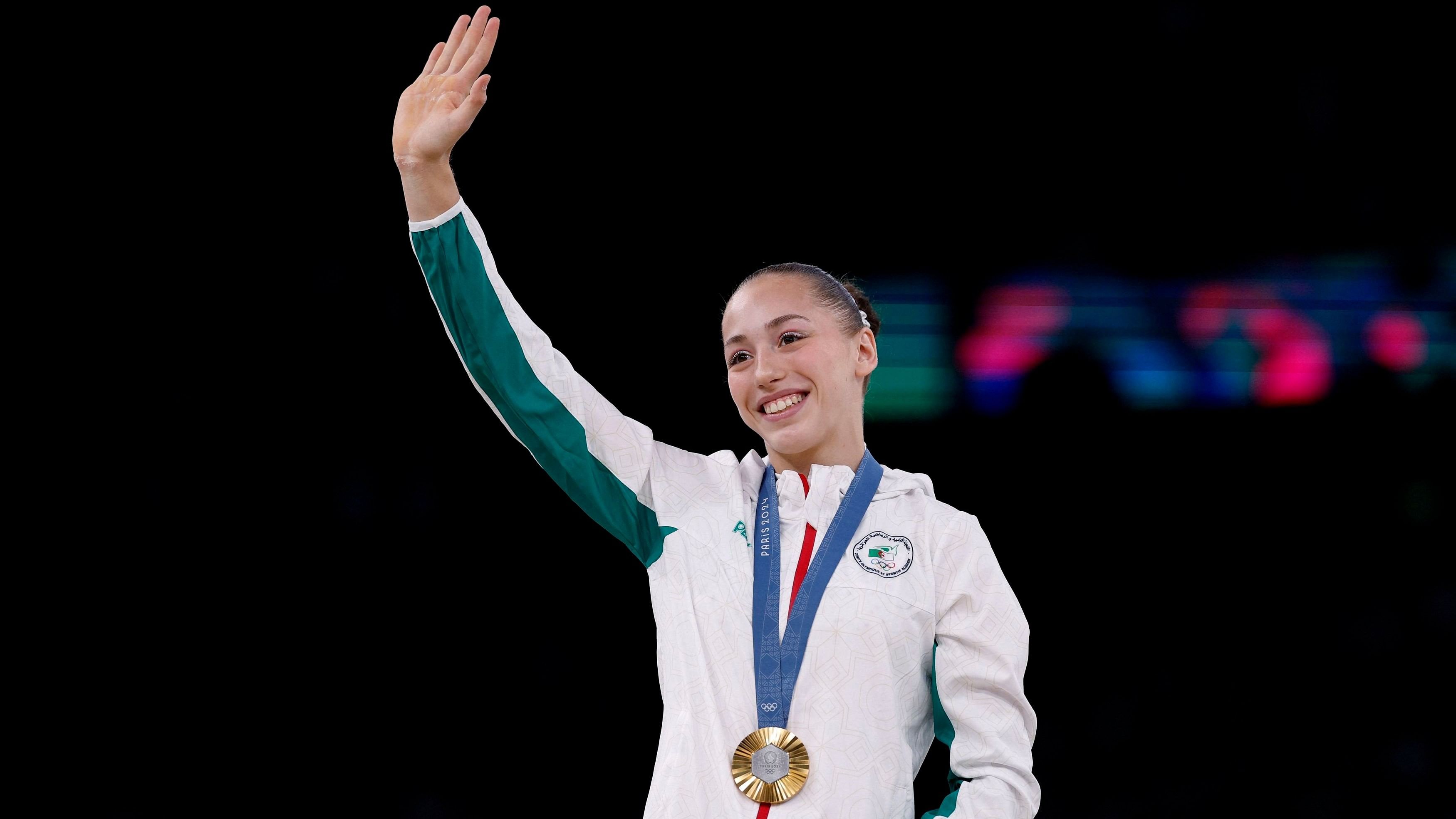 <div class="paragraphs"><p>Gold medallist Kaylia Nemour of Algeria celebrates with her medal on the podium.</p></div>