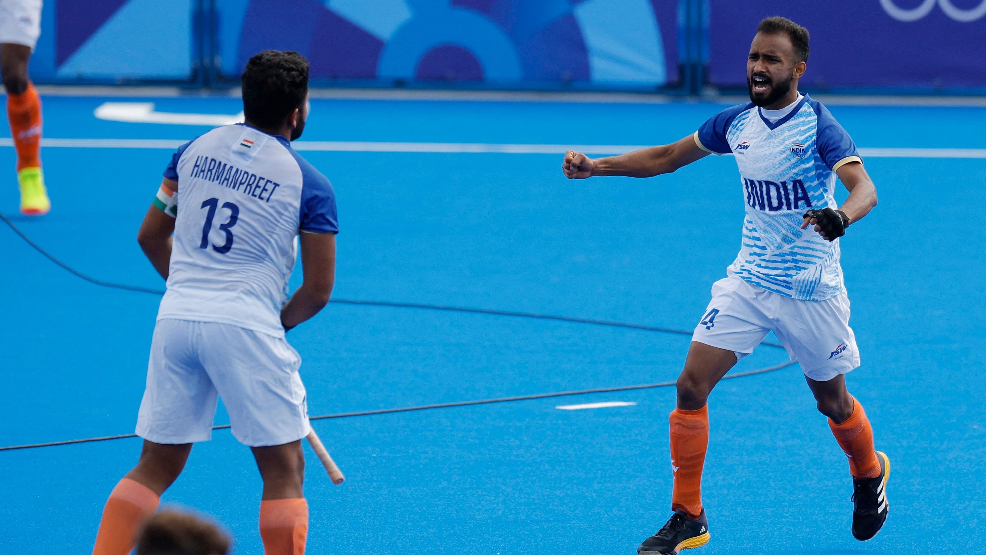 <div class="paragraphs"><p> Harmanpreet Singh of India and Sukhjeet Singh of India celebrate winning the match. </p></div>