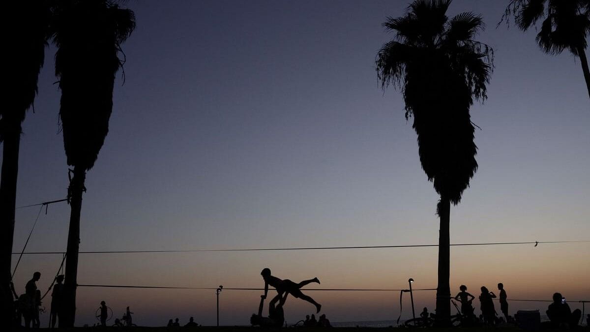 <div class="paragraphs"><p>People exercise in a park in Tel Aviv, Israel.</p></div>