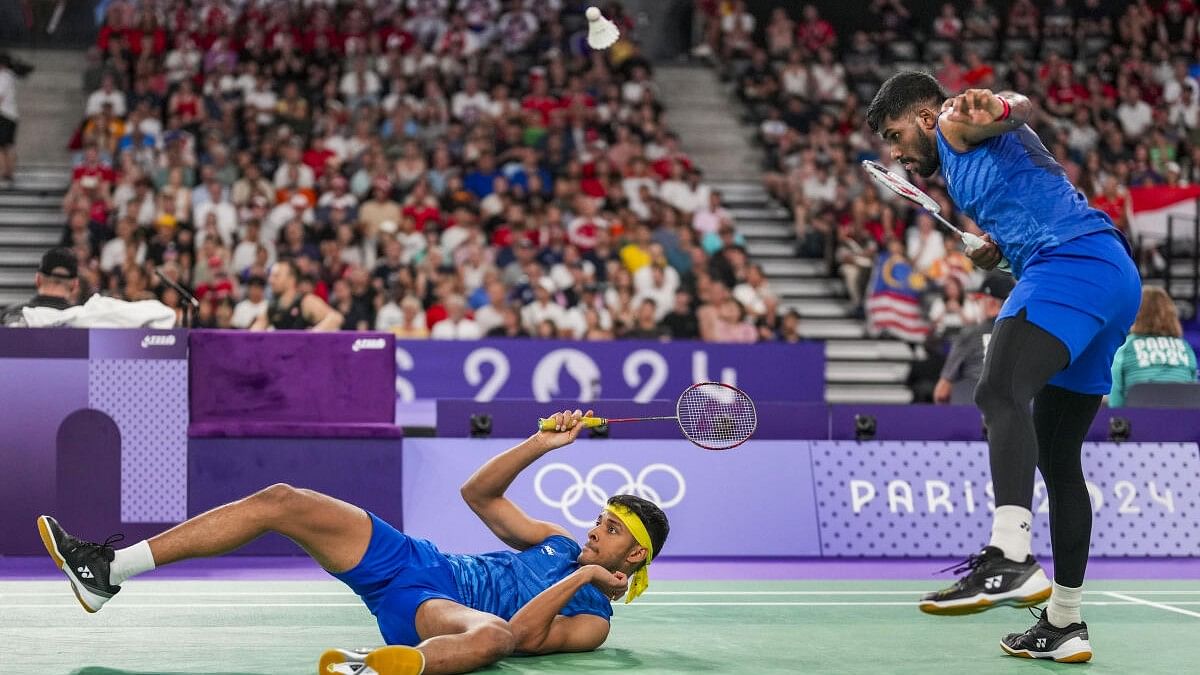 <div class="paragraphs"><p> India's Satwiksairaj Rankireddy and Chirag Shetty play against Malaysia's Aaron Chia and Soh Wooi Yik during their men's doubles quarterfinal badminton match at the 2024 Summer Olympics, in Paris, France, Thursday, August 1, 2024.</p></div>