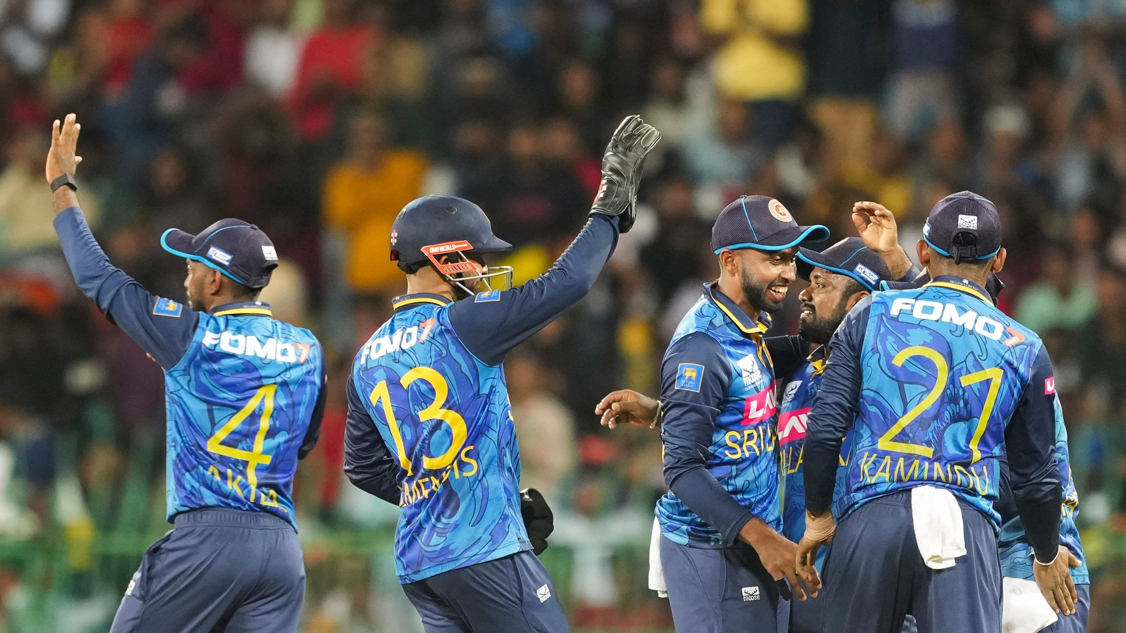 <div class="paragraphs"><p>Sri Lankan players celebrate the wicket of India's Rohit Sharma during the second ODI cricket match of the series between India and Sri Lanka, at R Premadasa International Stadium, in Colombo, Sunday, Aug. 4, 2024.</p></div>