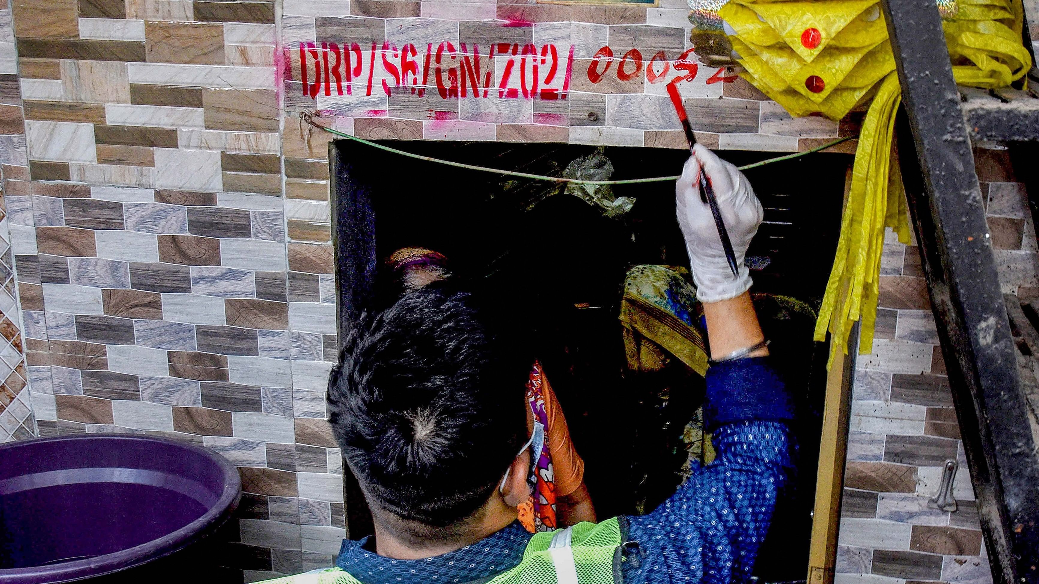 <div class="paragraphs"><p>An employee during survey being conducted to collect data from lakhs of tenants and residents for Dharavi Redevlopment Project Pvt. Ltd. (DRPPL), a joint venture between the Maharashtra goverment and Adani Group, at the Kamala Raman slum, in Mumbai. Image for representation.&nbsp;</p></div>