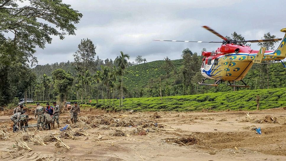 <div class="paragraphs"><p>A Navy helicopter during a rescue operation in the landslide-hit area, in Wayanad.</p></div>