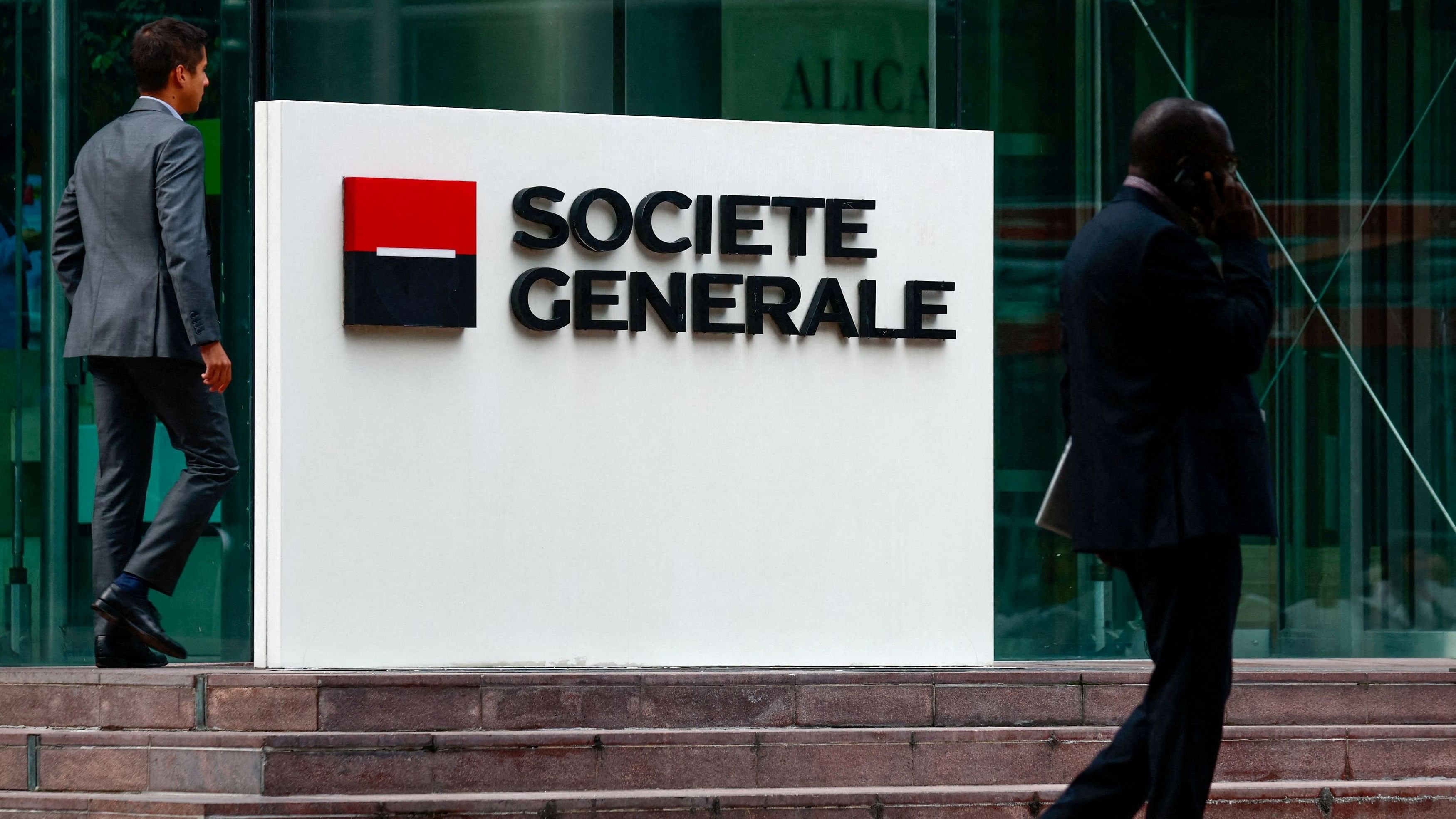 <div class="paragraphs"><p> People walk past a logo of French bank Societe Generale  near Paris, France.</p></div>