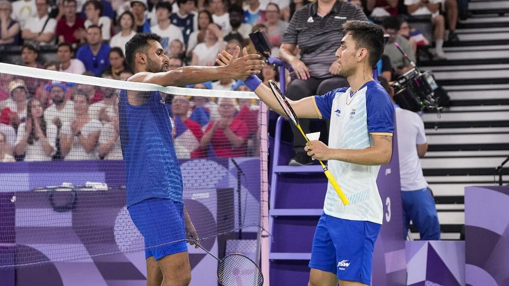 <div class="paragraphs"><p>Lakshya Sen (right) and HS Prannoy greet each other at the end of their men's singles Round of 16 badminton match in Paris.</p></div>