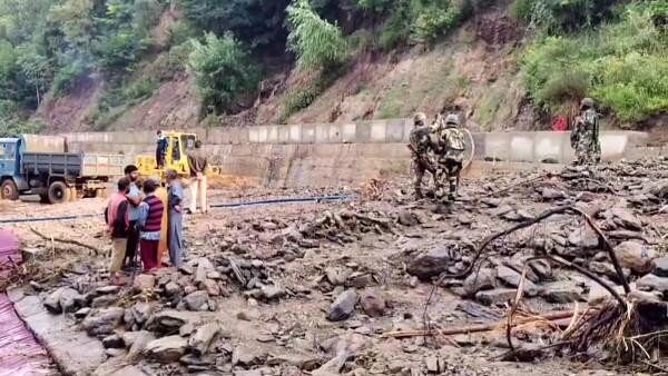 <div class="paragraphs"><p>Debris being cleared from a road following a cloudburst, at Kangan area in Ganderbal district, Jammu and Kashmir.</p></div>