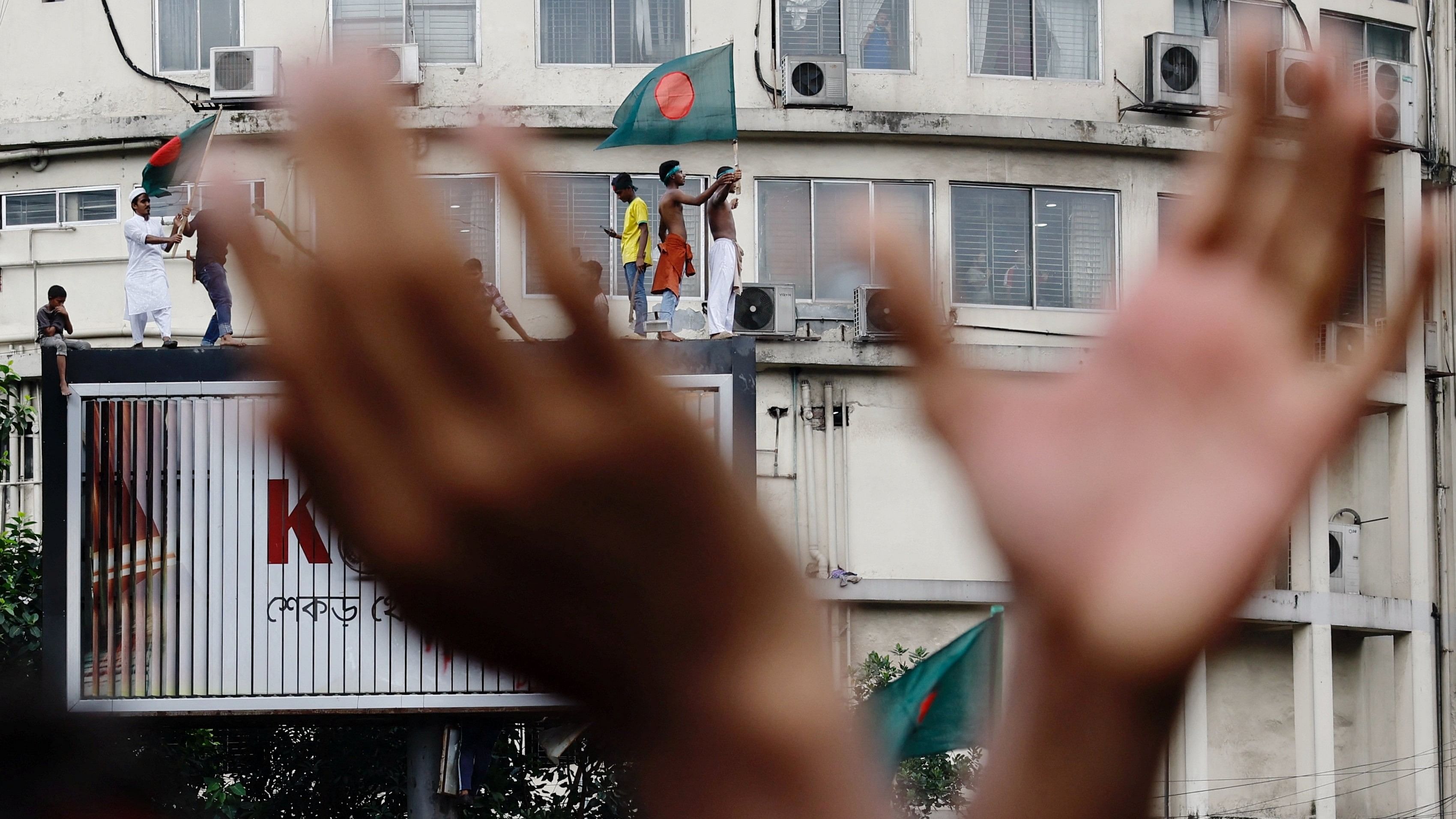 <div class="paragraphs"><p>People celebrate the resignation of Bangladeshi Prime Minister Sheikh Hasina in Dhaka, Bangladesh, August 5, 2024. </p></div>