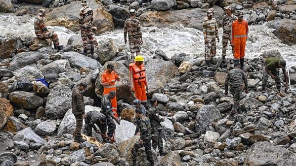 <div class="paragraphs"><p>Army and NDRF personnel carry out a search and rescue operation after a cloudburst at Samej village, in Rampur area of Shimla district.&nbsp;</p></div>