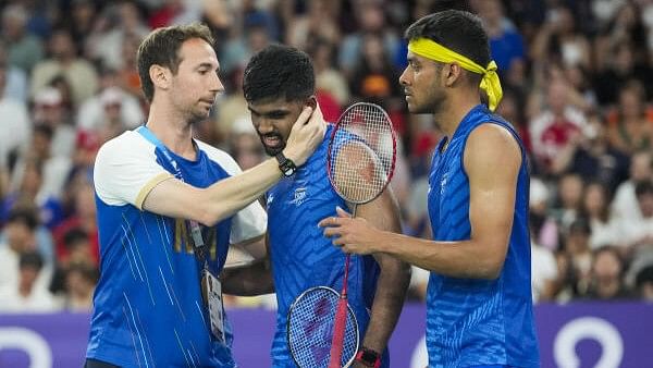 <div class="paragraphs"><p>India's Satwiksairaj Rankireddy and Chirag Shetty with coach Mathias Boe after their men's doubles quarterfinal badminton match against Malaysia's Aaron Chia and Soh Wooi Yik at the 2024 Summer Olympics, in Paris.&nbsp;</p></div>