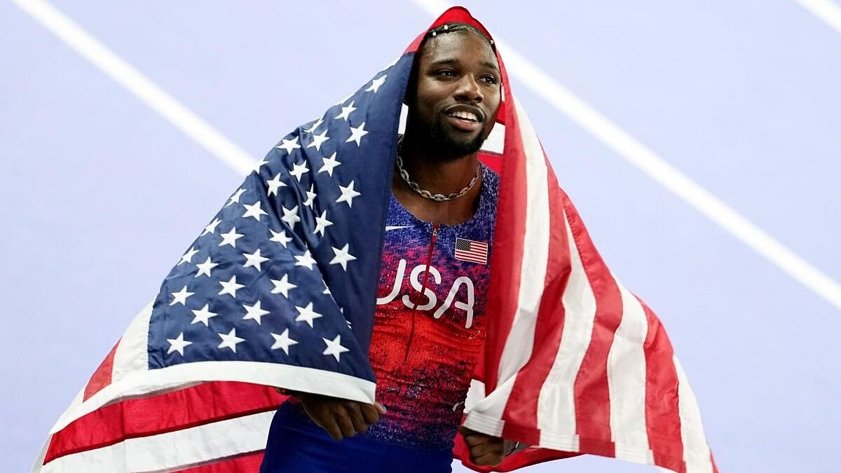 <div class="paragraphs"><p>Noah Lyles celebrates after winning the 100M gold.</p></div>