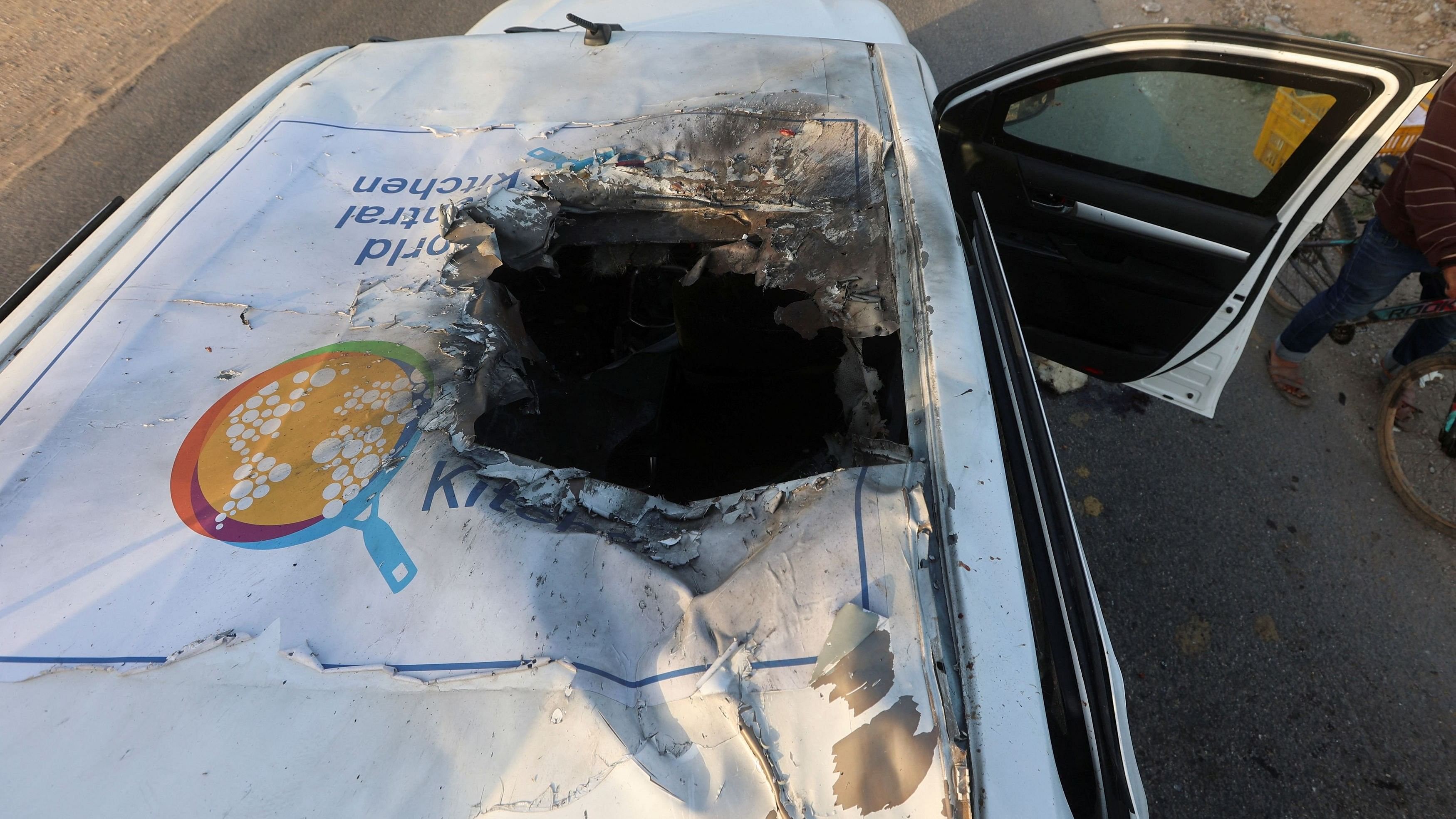 <div class="paragraphs"><p>A view of the destroyed roof of a vehicle where employees from the World Central Kitchen , including foreigners, were killed in an Israeli airstrike.</p></div>