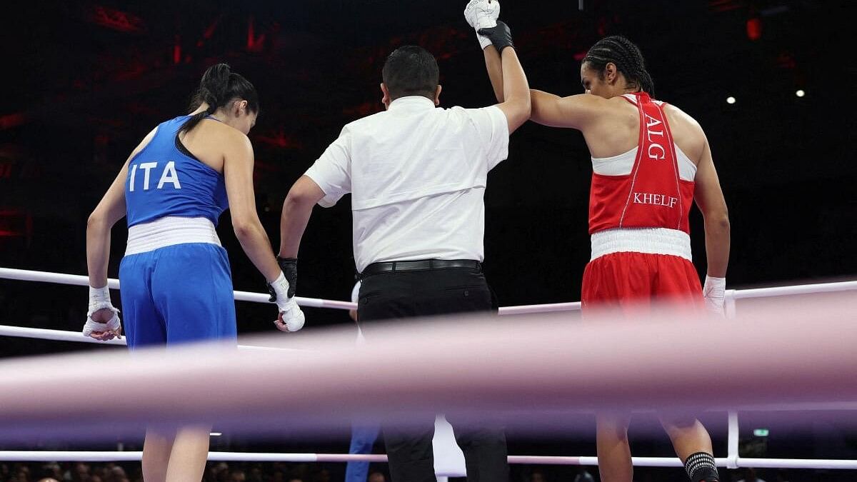 <div class="paragraphs"><p>Imane Khelif of Algeria has her hand raised after winning her fight against Angela Carini of Italy at the Paris Olympics.</p></div>