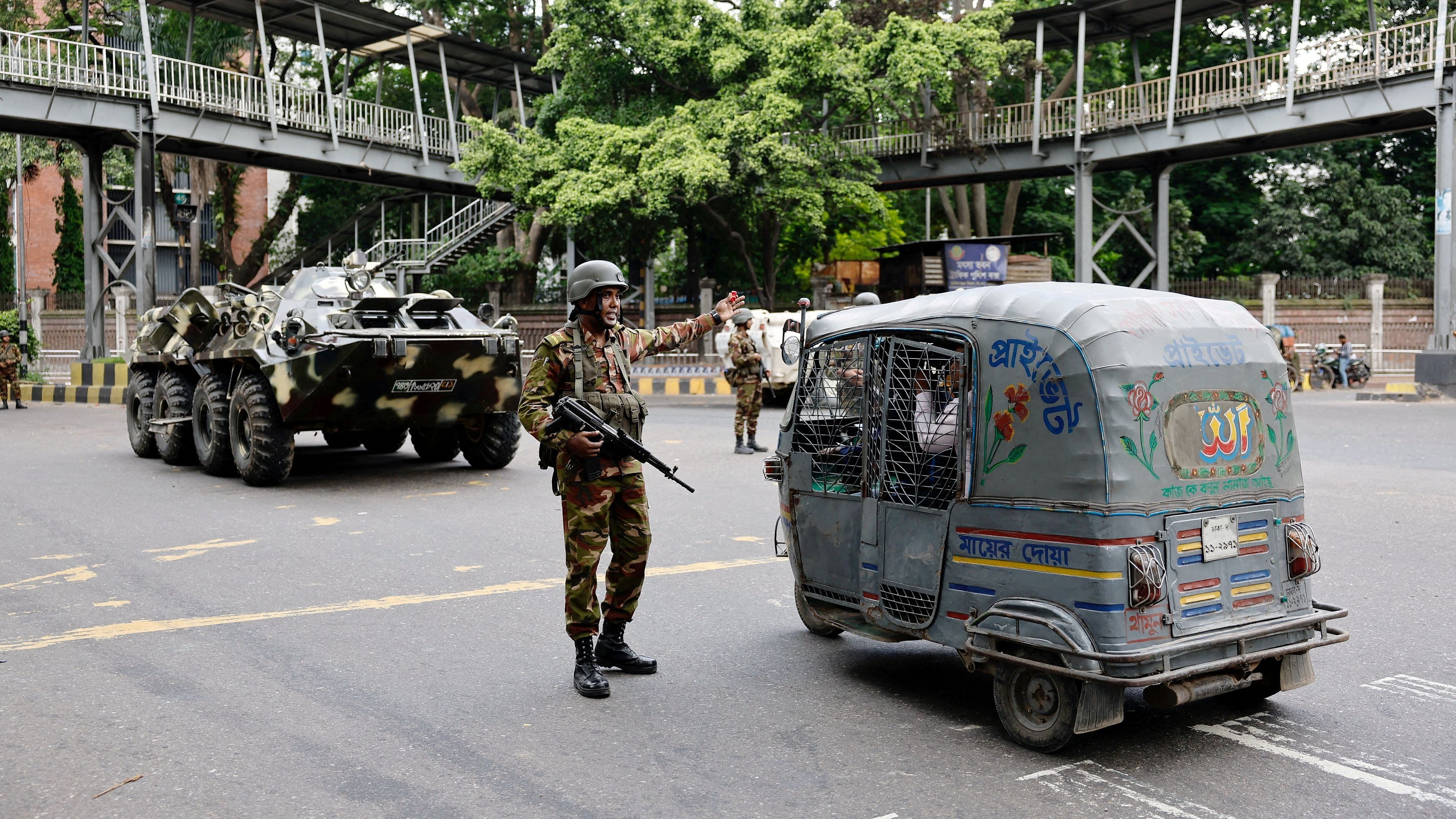 <div class="paragraphs"><p>Members of the Bangladesh Army are seen on duty in Dhaka.</p></div>