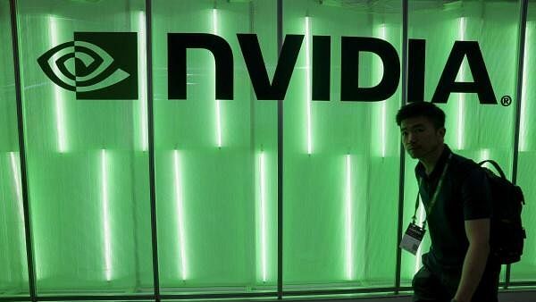 <div class="paragraphs"><p>A person walks pass a Nvidia logo</p></div>