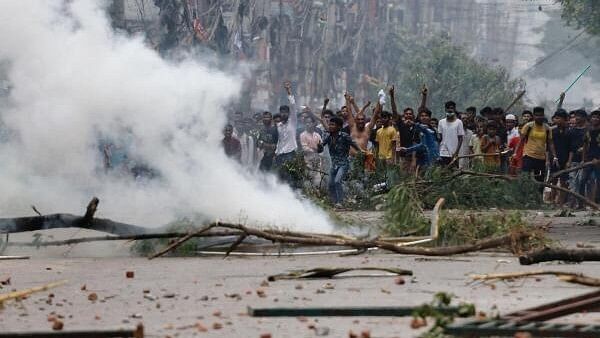 <div class="paragraphs"><p>Image showing tear gas used by forces in Bangladesh amid protests that sparked violence.</p></div>