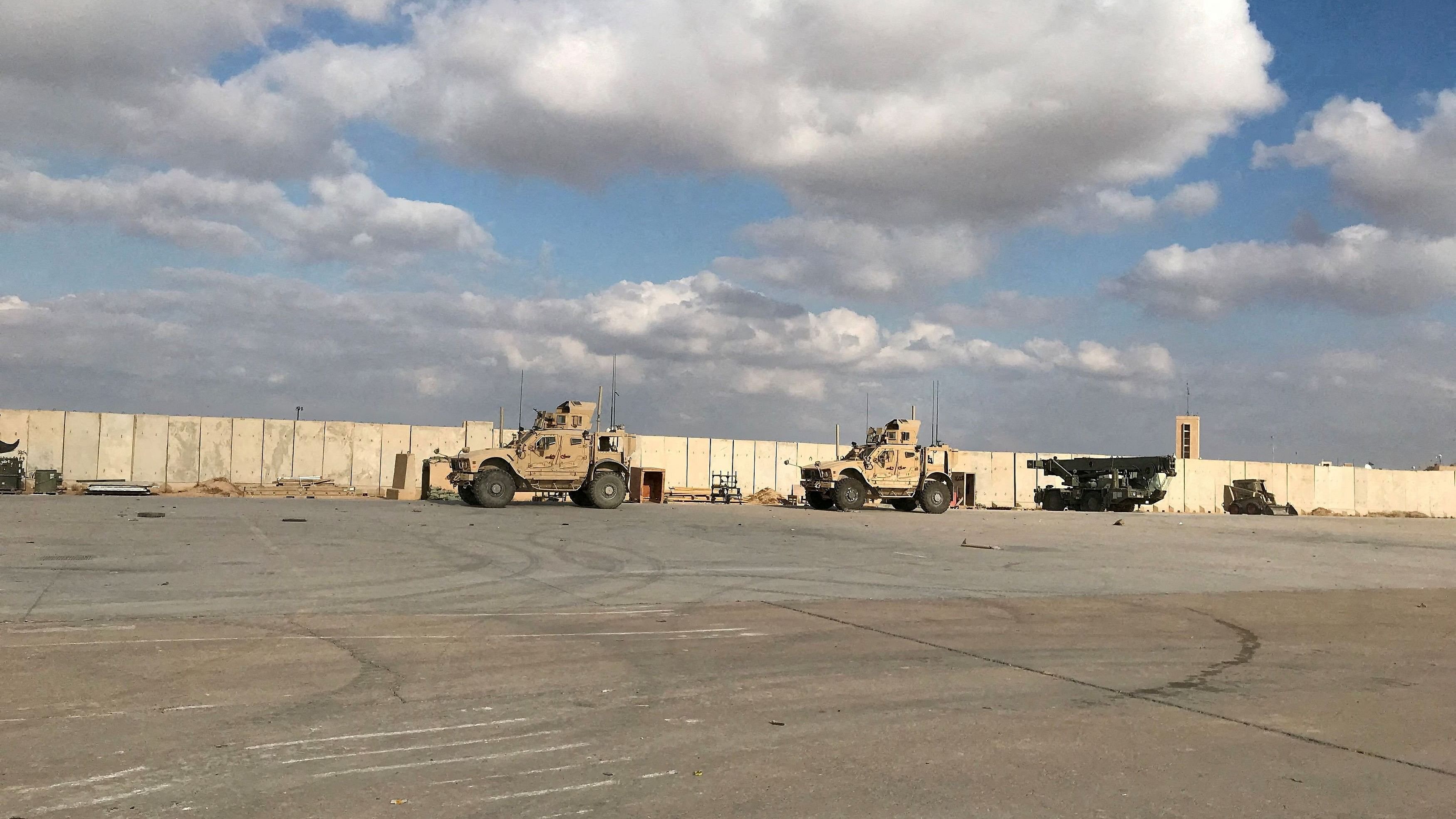 <div class="paragraphs"><p>Military vehicles of US soldiers are seen at the al-Asad air base in Anbar province, Iraq.</p></div>