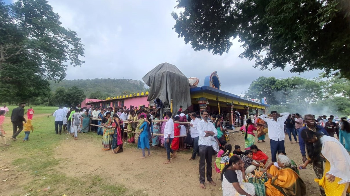 <div class="paragraphs"><p>Devotees wait for darshan at the Mahadeshwara temple as part of 'Bheemana Amavasye' at Beladakuppe in Hediyala range of Bandipur tiger reserve on Sunday.</p></div>