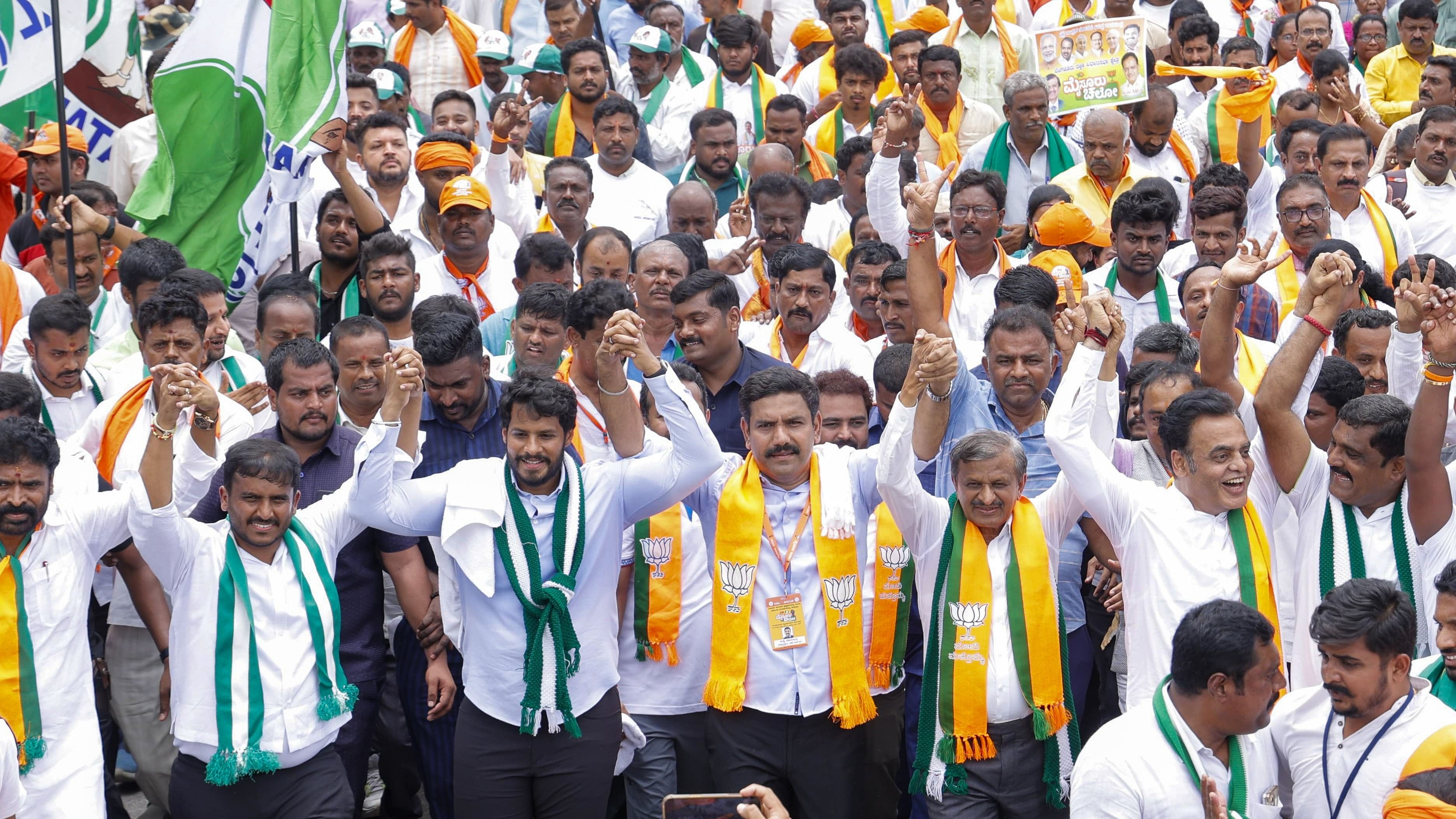 <div class="paragraphs"><p>JD(S) youth president Nikhil Kumaraswamy, BJP state president B Y Vijayendra, Lok Sabha member Dr C N Manjunath, MLA Dr C N Ashwath Narayan take part in 'Mysuru Chalo' padayatra, at Bidadi in Ramanagar district on Sunday. </p></div>