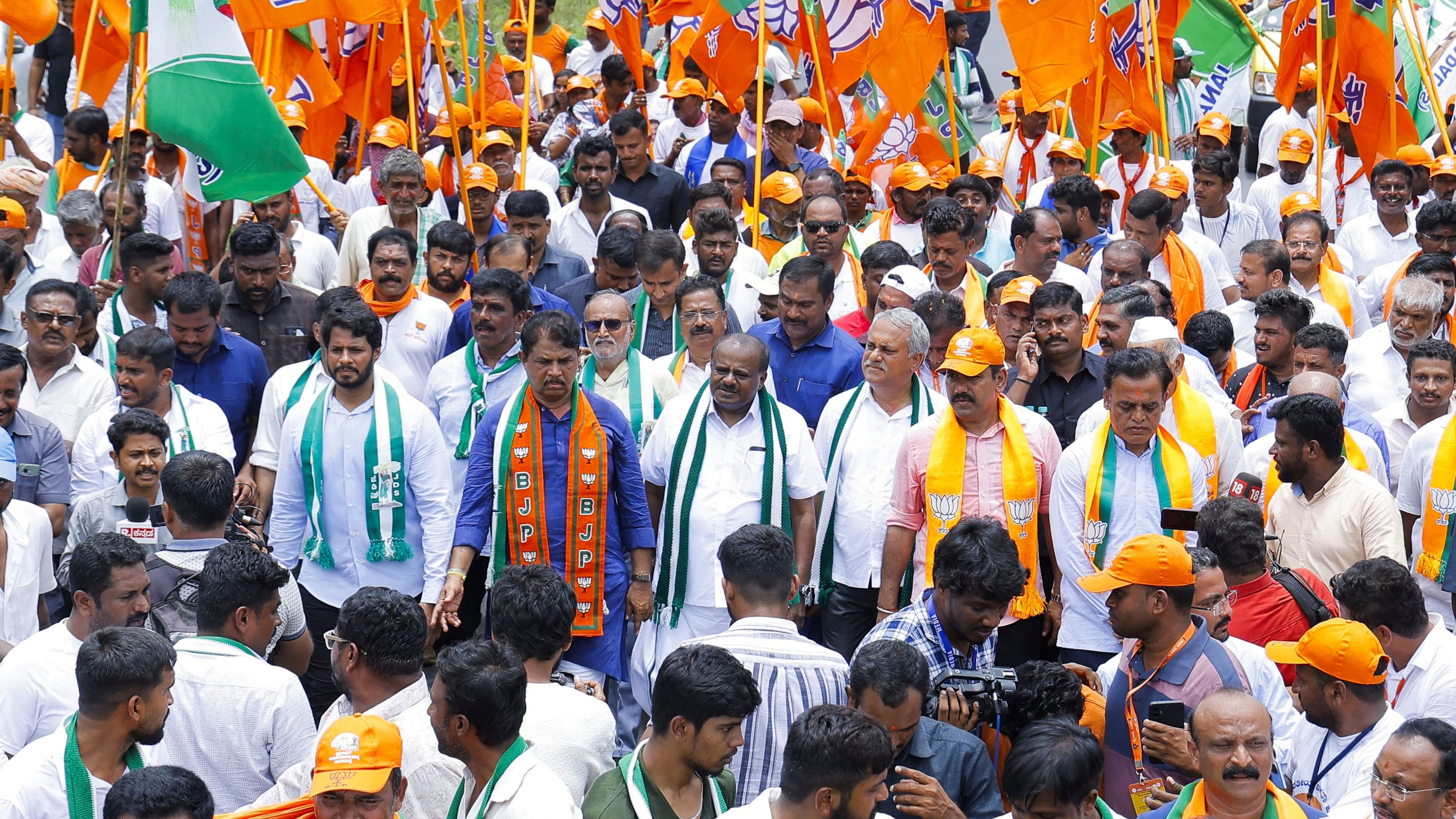 <div class="paragraphs"><p>Ramnagar: Union Minister &amp; JD(S) leader H D Kumaraswamy, his son and party youth leader Nikhil Kumaraswamy with Karnataka BJP Chief B Y Vijayendra, R Ashoka and others take part in Bengaluru-Mysuru padyatra against the alleged MUDA scam and Valmiki Corporation scam, in Ramnagar near Bengaluru, Monday, Aug 5, 2024. </p></div>